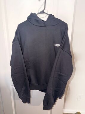 ESSENTIALS Black Pullover Hoodie with Subtle Chest Logo